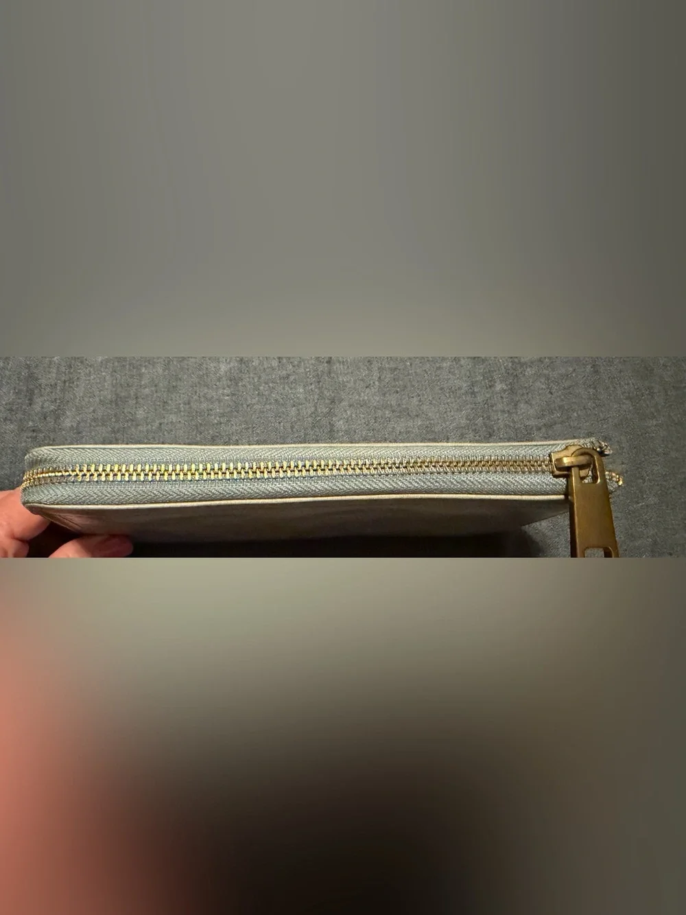Margot “Gabby” zip around wallet in grey/beige with light blue accents.